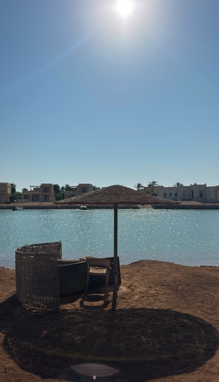 Lagoon and sunbeds outside West Golf apartment