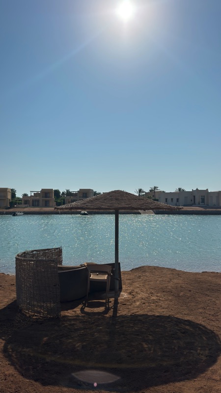 Lagoon and sunbeds outside West Golf apartment